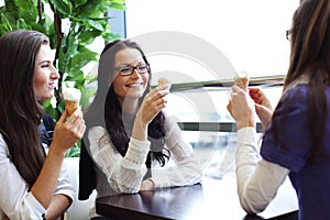 Women licking ice cream