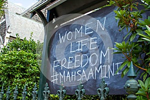 Women, Life, Freedom sign on chalkboard