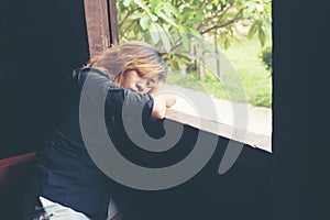 Women lifestyle concept young sad woman sitting on bench besid