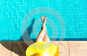 Women lifestyle relaxing near luxury swimming pool sunbath, summer day at the beach resort in the hotel