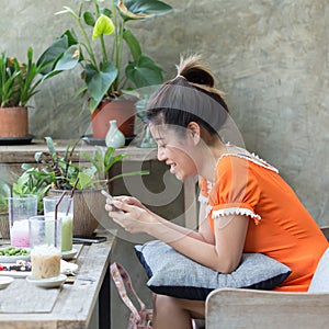 Women lifestyle using a mobile phone in cafe coffee