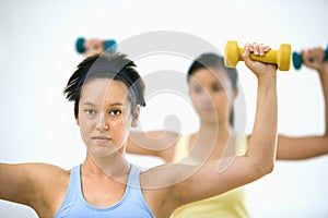 Women lifting hand weights photo