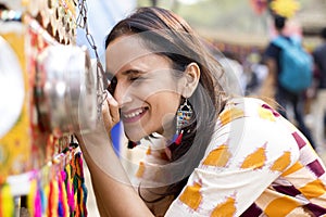 Women looking into bioscope at Surajkund Mela photo