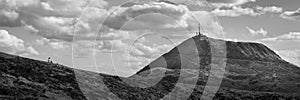 A women looking at the puy de dome in clermont ferrand france from the parriou