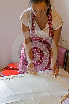 Women make homemade pasta in the kichen