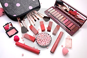 Women Make up Cosmetics bag and set of professional decorative, red lipsticks and brush makeup, perfume and sponge with pink pearl