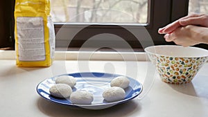 Women makes cheese pancakes in her country house