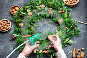 Women making Christmas wreath. New year holidaydecoration photo