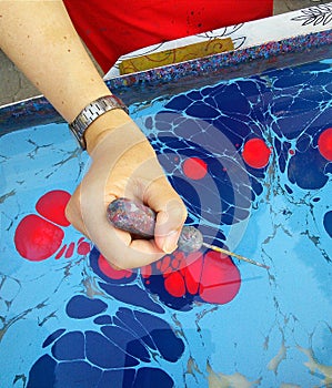 Women making ebru