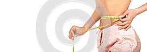 Women measures a waist. Woman take waist scale tape show her thin waist. Closeup woman measuring her waist with tape