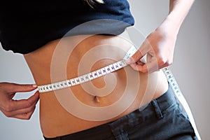 Women measuring waist