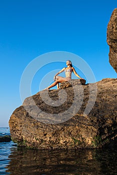 Women meditation pose at amazing sunset