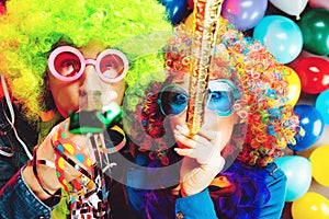 Women and men celebrating at party for new years eve or carnival