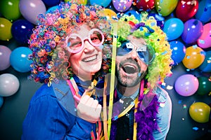 Women and men celebrating at party for new years eve or carnival