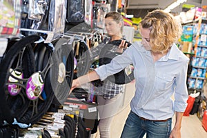 Women in motoring accessories shop photo