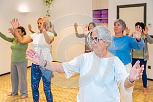 Women moving coordinated closing a qi gong class