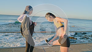 Women, ocean or stretching in fitness running, workout or training by beach or sea for body healthcare, cardio or