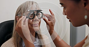 Women, optometrist and patient with trial lens for eye exam, vision test and prescription fro glasses at store. Doctor photo