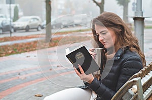 Women in outdoors reading Bible. Concept for faith, spirituality and religion