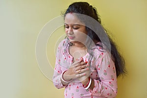 Women with pain at the heart. Young women with heart disease. Women have symptoms of heart attack, congestive heart failure photo