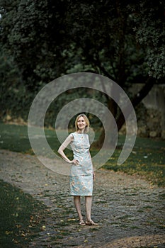 Women in the park in a seventies style dress.