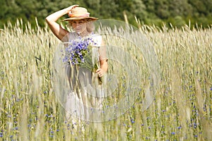 Women picking blue flowers