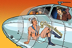 Women pilots girls. Pinup man on the fuselage of a retro bomber photo