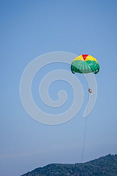 The women playing parachute on blue sky