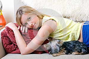 Women plays with a puppy of a terrier