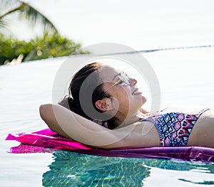 Women on a pool inflatable