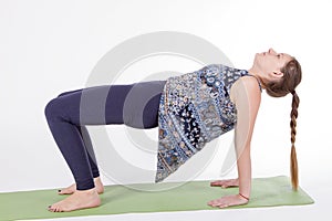 Women practice yoga table asana