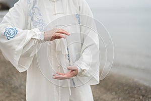 Women practicing Taijiquan on the beach