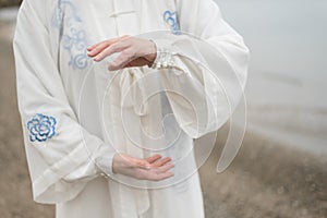 Women practicing Taijiquan on the beach