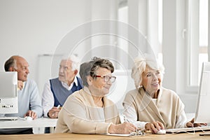 Women practicing using computer