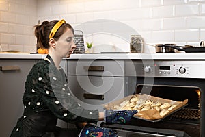 Women preparing homemade food pie, pizza in a cozzy kitchen. Hobbies and family life concept