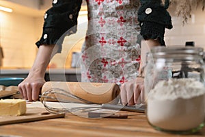Women preparing homemade food pie, pizza, pasta with a dough roll. Hobbies and family life concept