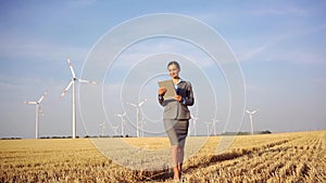 Women putting money into an ethical Investment of wind turbines