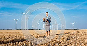 Women putting money into an ethical Investment of wind turbines