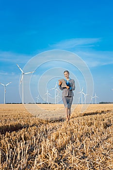 Women putting money into an ethical Investment of wind turbines