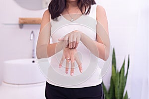 Woman with rash or papule and scratch on her hands from allergies,Health allergy skin care problem,Psoriasis vulgaris