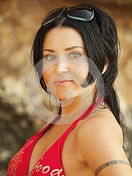 Women in red bikini at the pebble beach