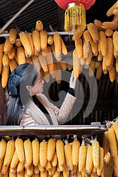 Women, red lanterns and corn in the attic