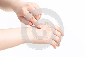 Women rub cosmetics open  in front of white background