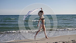 women running along beach on background sand and sea, Free happy woman, happy girl in swimsuit,