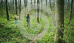 Women running in forest.