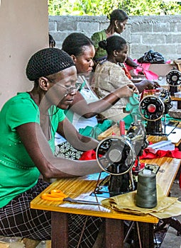 Working on donated sewing machines in rural Haiti.