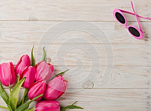 Women`s accessories - a hat, sunglasses and shoes. A bouquet of