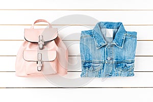 Women`s backpack and jeans jacket.