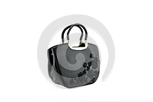 Women`s black handbag isolated on white background.