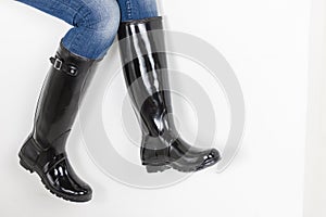 women& x27;s black rubber boots with blue jeans